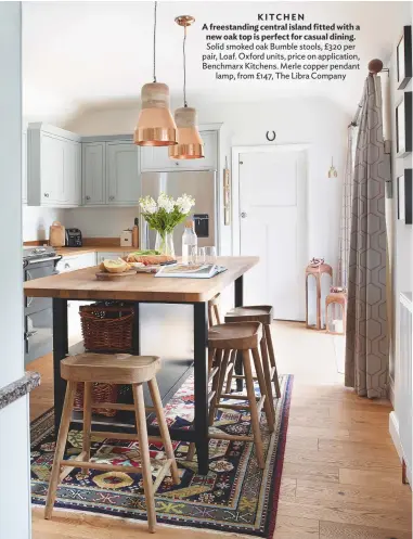  ??  ?? KITCHEN A freestandi­ng central island fitted with a new oak top is perfect for casual dining. Solid smoked oak Bumble stools, £320 per pair, Loaf. Oxford units, price on applicatio­n, Benchmarx Kitchens. Merle copper pendant lamp, from £147, The Libra...