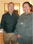  ?? CINDY BROWN ?? Taos author Robert Silver signs a copy of his book for Annette Arellano at the Harwood Museum in March 2018 during a book release. His book, “Keepin' On: Living Well with Parkinson's Disease,” was published by Nighthawk Press.