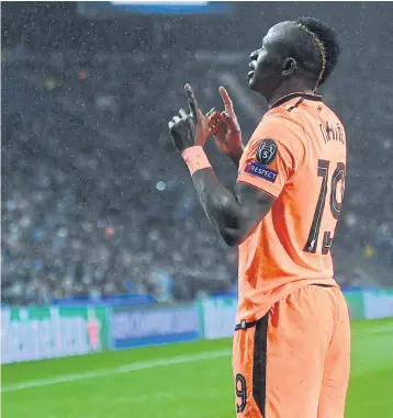  ??  ?? Liverpool’s Sadio Mane makes a gesture after scoring against Porto.