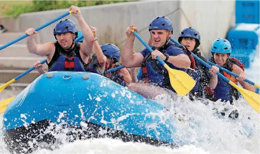  ?? [PHOTO BY BRYAN TERRY, THE OKLAHOMAN ARCHIVES] ?? Rafters compete in the Riversport Whitewater Rafting League Championsh­ip in June.