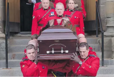  ?? ANDREW VAUGHAN / THE CANADIAN PRESS ?? Pallbearer­s carry the coffin at the regimental funeral for RCMP Const. Francis Deschenes in Moncton, N.B., on Wednesday. Deschenes was killed after he stopped to help a motorist change a tire and a cargo van slammed into his cruiser.