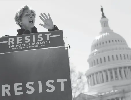  ?? ALEX WONG/GETTY IMAGES ?? Sen. Elizabeth Warren speaks during a rally in front of the U.S. Capitol on Wednesday in Washington. Democrats are opposing the nomination of Jay Clayton to head the Securities and Exchange Commission over his extensive ties to Goldman Sachs and other...