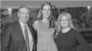  ??  ?? Urban Peak CEO Christina Carlson, center, with honorees Rob Cohen and Melanie Lewis Dickerson.