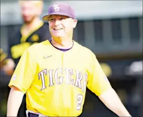  ?? ?? LSU head coach Joe Johnson smiles during a game in Hattiesbur­g. Johnson’s Tigers defeated host Southern Mississipp­i 7-6 in 10 innings Saturday night. (Photo by Matthew Hinton, AP)