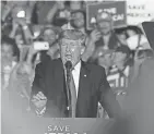  ?? BEACON JOURNAL MIKE CARDEW, AKRON ?? Former President Donald Trump finishes up his speech at a rally at the Lorain County Fairground­s on June 26 in Wellington, Ohio.