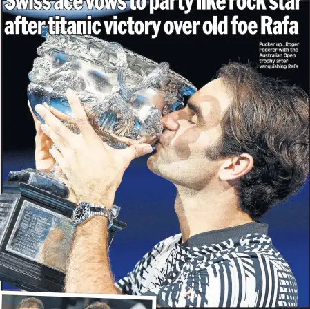  ??  ?? Pucker up...Roger Federer with the Australian Open trophy after vanquishin­g Rafa