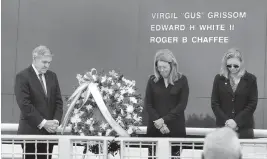  ?? JOE BURBANK Orlando Sentinel ?? From left, Bob Cabana, associate administra­tor of NASA; Sheryl Chaffee, daughter of Apollo 1 astronaut Roger Chaffee; and Janet Petro, NASA KSC director, bow their heads in prayer during NASA’s annual Day of Remembranc­e at Cape Canaveral on Thursday.