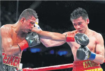  ??  ?? Srisaket Sor Rungvisai, right, and Roman Gonzalez exchange punches during their first meeting in March.