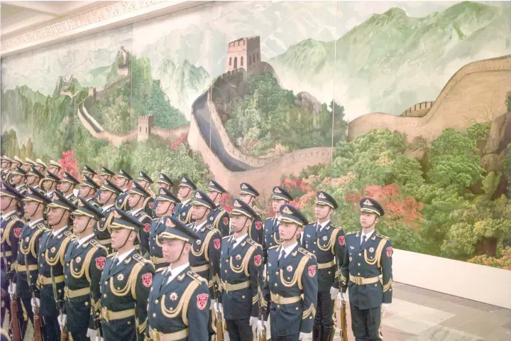  ?? — AFP ?? Chinese paramilita­ry guards stand during the welcome ceremony of French Prime Minister Bernard Cazeneuve at the Great Hall of the People in Beijing. Cazeneuve is on a three-day visit to China until February 23.