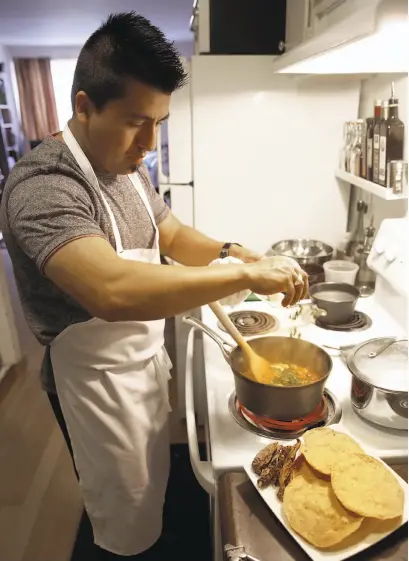  ?? Photos by Liz Hafalia / The Chronicle ?? Chef Gonzalo Guzman of Nopalito, which serves regional Mexican food, makes Chicken Tinga Tostadas at home in S.F.