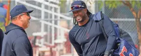  ?? ROSS D. FRANKLIN/AP ?? Guardians’ 1B Josh Bell, right, laughs with assistant hitting coach Victor Rodríguez at spring training on Feb. 17 in Goodyear, Ariz.