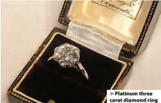  ?? ?? > Platinum three carat diamond ring
