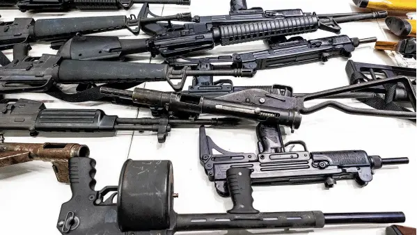  ?? DAMIAN DOVARGANES/AP 2012 ?? A federal judge ruled that California’s definition of illegal military-style rifles unlawfully deprives law-abiding residents of weapons already commonly allowed. Above, firearms at a gun buyback event in Los Angeles.