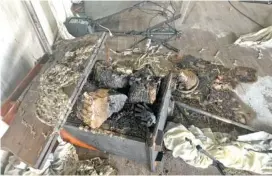  ?? STAFF PHOTO BY ELLEN GERST ?? A wooden podium is seen burned with wood on top following a suspected arson at the Chattanoog­a Masonic Center in September.