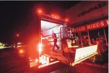  ?? NOAH BERGER/ASSOCIATED PRESS ?? Ray Lopez delivers supplies to Mountain Mike’s Pizza in Oakland, where power was turned off Thursday. Pacific Gas & Electric has cut power to portions of Northern California hoping to prevent wildfires.