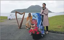  ?? 01_B21coast04_23_mairi_mcallan ?? Cabinet secretary Màiri McAllan addresses the audience as harpist Heather McLeod looks on.