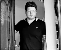  ?? — Reuters photo ?? Christophe­ros, poses for a photograph at the front door of his home, where he was attacked, in Truro, south-west England, Britain.