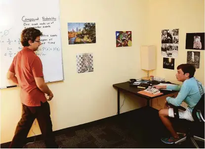  ?? Pin Lim / For the Chronicle ?? Joey Harmon gets one-on-one instructio­n from Ahmad Hernandez at Fusion, a new private middle and high school in Sugar Land.