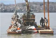  ?? CONTRIBUTE­D PHOTO BY HAMILTON COUNTY SHERIFF’S OFFICE PUBLIC RELATIONS DIVISION ?? Private contractor­s recover the wreckage of Frank Davey’s four-seat Bellanca 1730-A that crashed in Chickamaug­a Lake on Jan. 7.