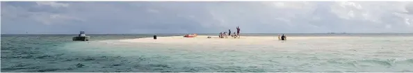  ?? MAGENTA HYDE/FOR THE WASHINGTON POST ?? Guests of the Mandala Island Resort in the Kingdom of Tonga visit a nearby sand cay, which appears only at low tide.