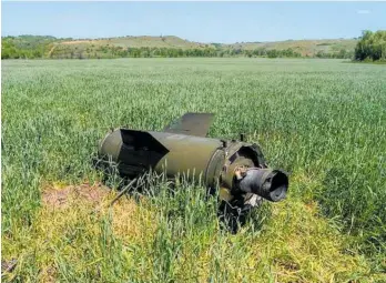  ?? Photo / AP ?? A Russian missile lays on a wheat field near Soledar in eastern Ukraine, a stark reminder of the impact of the war on world hunger.