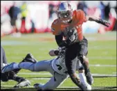  ?? Joel Angel Juarez Las Vegas Review-Journal ?? UNLV running back Lexington Thomas carries against Utah State on Saturday at Sam Boyd Stadium.