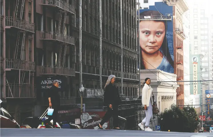  ?? Justin Sullivan / Gett y Imag es ?? A four-storey-high mural honouring Swedish climate activist Greta Thunberg earlier this month in San Francisco as it was nearing completion.