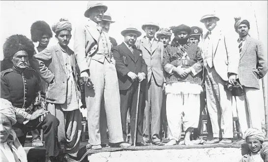  ?? WALTER BOSSHARD/145/ARCHIVES OF CONTEMPORA­RY HISTORY ETH ZURICH ?? Chicago Tribune foreign correspond­ent William L. Shirer, center, standing at the right of the man with a cane, was one of a small number of Westerners who were in Kabul for the October 1930 coronation of Nadir Shah, also known as Nadir Khan, as Afghanista­n’s new king.