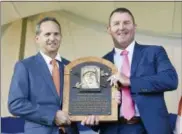  ?? HANS PENNINK — THE ASSOCIATED PRESS ?? Hall of Fame President Jeff Idelson, left, poses with Jim Thome, during an induction ceremony at the Clark Sports Center on Sunday in Cooperstow­n, N.Y.