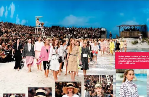  ??  ?? Models present creations by Chanel at the end of the Spring-Summer 2019 Ready-to-Wear collection fashion show at the Grand Palais in Paris. — AFP photos