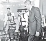  ??  ?? Vereline, a former Army sergeant, takes steps in her ReWalk gear in 2013 as then-President Barack Obama looks on.