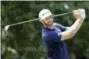  ?? MARK HUMPHREY — THE ASSOCIATED PRESS ?? Dustin Johnson watches his drive on the seventh hole during the final round of the St. Jude Classic golf tournament Sunday in Memphis, Tenn.