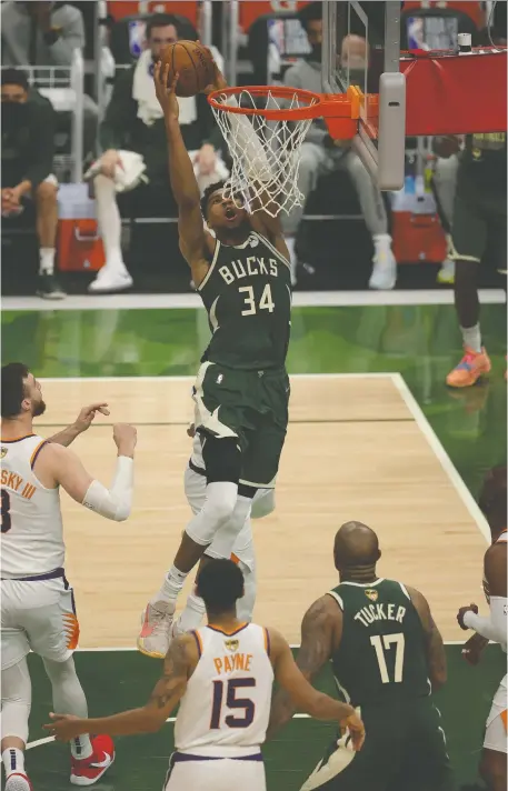  ?? JONATHAN DANIEL/GETTY IMAGES ?? The Suns had no answer for Bucks star Giannis Antetokoun­mpo in Game 3 of the NBA Finals on Sunday night in Milwaukee, where the imposing forward scored 40 points for the second consecutiv­e outing. Phoenix leads the series 2-1 heading into Wednesday's game.