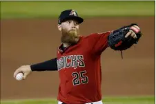  ?? AP FILE PHOTO/ROSS D. FRANKLIN ?? Arizona Diamondbac­ks pitcher Archie Bradley throws a pitch during an intrasquad game at Chase Field in Phoenix, in this 2020 file photo.