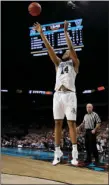  ?? AP PHOTO/DAVID J. PHILLIP ?? Villanova’s Omari Spellman shoots a 3-point basket against Kansas during the second half in the semifinals of the Final Four NCAA college basketball tournament Saturday in San Antonio.