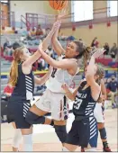  ?? Diana Jost ?? Heritage’s Sydnee St. John draws contact on her way to the hoop during Saturday’s season-opener against Coahulla Creek.