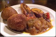  ?? Arkansas Democrat-Gazette/HELAINE R. WILLIAMS ?? Sample dishes such as this one, consisting of plantain slices, pepper sauce and rice akara, are served at Kontiki African Restaurant in Alexander. The eatery, which opened in January, offers authentic African cuisine.