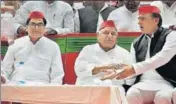  ?? PTI ?? (From left) Samajwadi Party leader Ramgopal Yadav, party patriarch Mulayam Singh Yadav and SP chief Akhilesh Yadav at a rally in Delhi on Saturday.