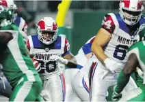  ?? MARK TAYLOR/THE CANADIAN PRESS ?? Alouettes running back Tyrell Sutton runs the ball against the Saskatchew­an Roughrider­s at Mosaic Stadium in Regina during Montreal’s 23-17 victory on Saturday.