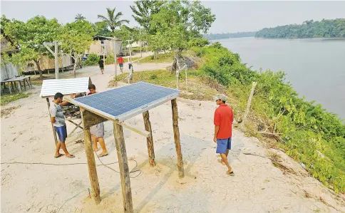  ??  ?? Remote communitie­s in the Amazon are being encouraged by The World Wildlife Fund (WWF) to use solar power to power their villages. A reduced reliance on fuel is believed to lessen the impact on natural areas and reduce costs so that people don’t...