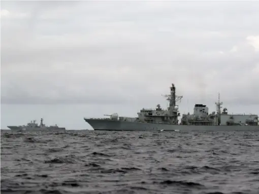  ?? (Ministry of Defence) ?? HMS Richmond (right) escorts Russian vessel Admiral Kuznetsov
