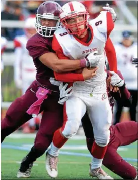  ?? TANIA BARRICKLO — DAILY FREEMAN ?? Liberty’s Zacharias Fitzpatric­k is taken down by New Paltz’s Joseph DiMarco.