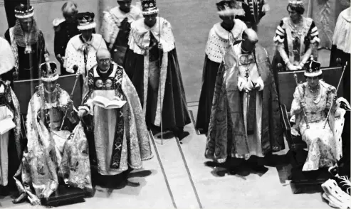  ?? ?? DOUBLE CEREMONY:
George VI and his wife Elizabeth – later the Queen Mother – were crowned together in Westminste­r Abbey in 1937