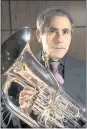  ?? COURTESY OF LINDA WINTER ?? A profession­al musician, Denis Winter played his euphonium and trombone around the world.