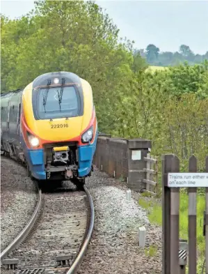  ?? JOHN STRETTON. ?? On May 21, East Midlands Trains 222002 (left) heads south at Market Harborough with the 1429 SheffieldS­t Pancras Internatio­nal, passing EMT 222016 as it approaches the station stop with the 1429 St Pancras Internatio­nal-Nottingham. The new East Midlands franchise wants bi-mode trains on this route capable of significan­tly improving journey times and being able to outperform the ‘222s’.