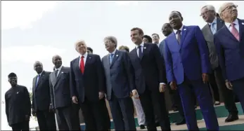  ?? JONATHAN ERNST/POOL PHOTO VIA AP ?? Various world leaders pose for a photo with other G7 leaders during a G7 summit in Taormina, Italy on Saturday.
