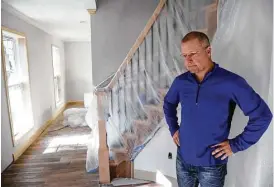  ?? Jon Shapley / Houston Chronicle ?? Todd Middleton shows his frustratio­n while talking about damage to his Norchester home near Cypress Creek after the family’s second flood.