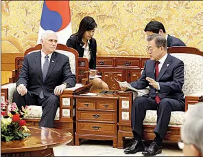  ?? AP/KIM HEE-CHUL ?? Vice President Mike Pence and South Korean President Moon Jae-in hold talks Thursday at the Blue House presidenti­al office in Seoul. Pence declared the U.S. “resolve to stand with you is unshakable,” but officials said that in private the vice...