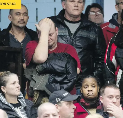  ?? LARS HAGBERG/AFP/GETTY IMAGES ?? A member reacts as union leaders speak at Local 222 in Oshawa, Ont., on Monday, after auto giant General Motors announced it will cut 15 per cent of its workforce to save $6 billion, including the assembly plant that has served as the Toronto-area community’s anchor for decades.