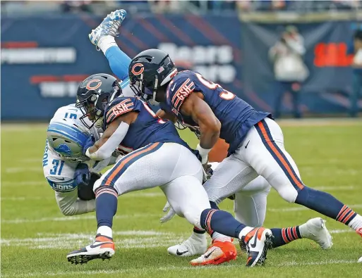  ?? NUCCIO DINUZZO/GETTY IMAGES ?? Trevathan (shown making a tackle last season against the Lions at Soldier Field) suffered a dislocated left elbow in Week 10 in 2019.
